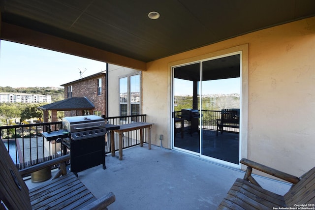 exterior space featuring a grill and a balcony