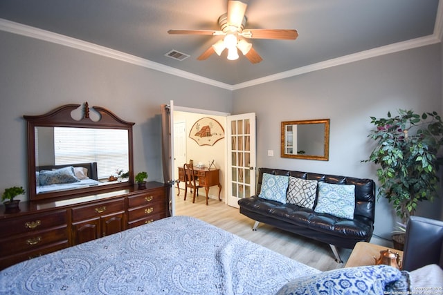 bedroom with ceiling fan, light hardwood / wood-style floors, and crown molding