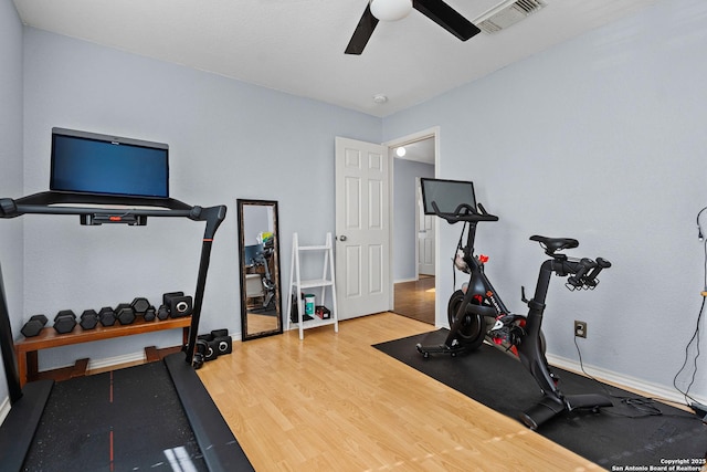 workout area featuring ceiling fan and wood-type flooring