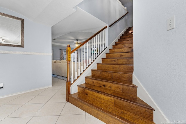 staircase with tile patterned flooring and ceiling fan