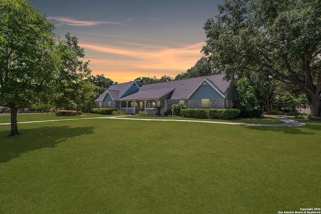 view of front of house with a yard