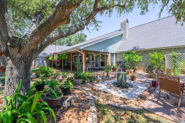 back of house featuring a patio area and french doors