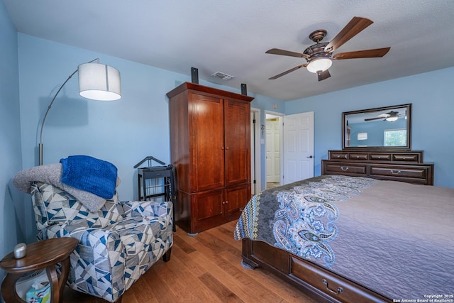 bedroom featuring ceiling fan and hardwood / wood-style flooring