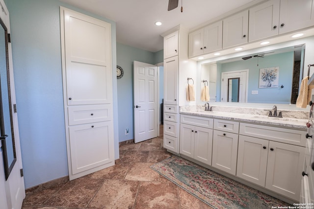 bathroom featuring vanity and ceiling fan