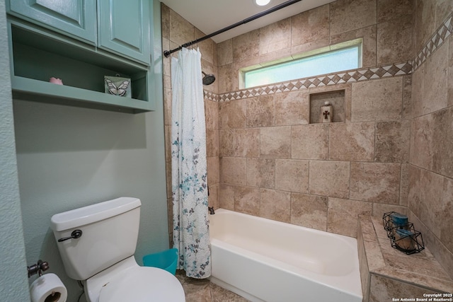 bathroom with toilet and shower / bath combo with shower curtain