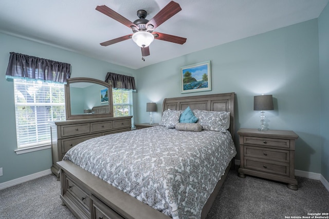 bedroom with dark colored carpet and ceiling fan