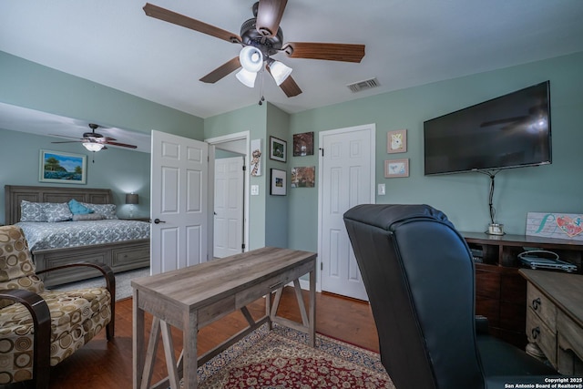 home office with dark wood-type flooring