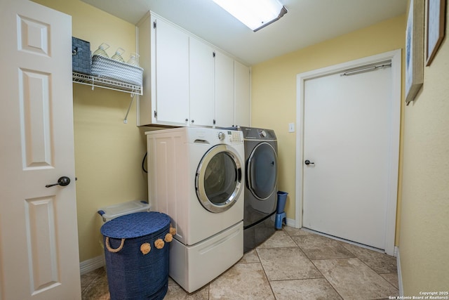 laundry area with cabinets and washer and dryer