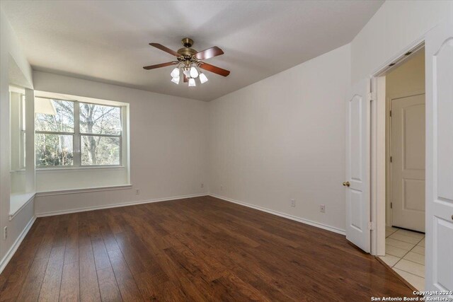 spare room featuring ceiling fan and wood-type flooring