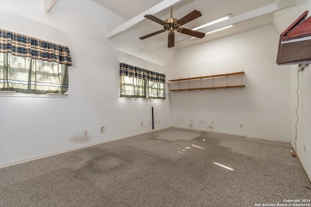 spare room featuring carpet flooring, vaulted ceiling with beams, and ceiling fan