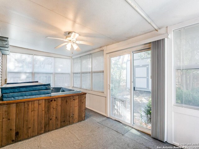 sunroom / solarium with ceiling fan