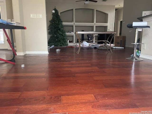 exercise area featuring ceiling fan and wood-type flooring