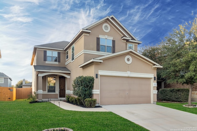 view of front facade featuring a garage and a front yard