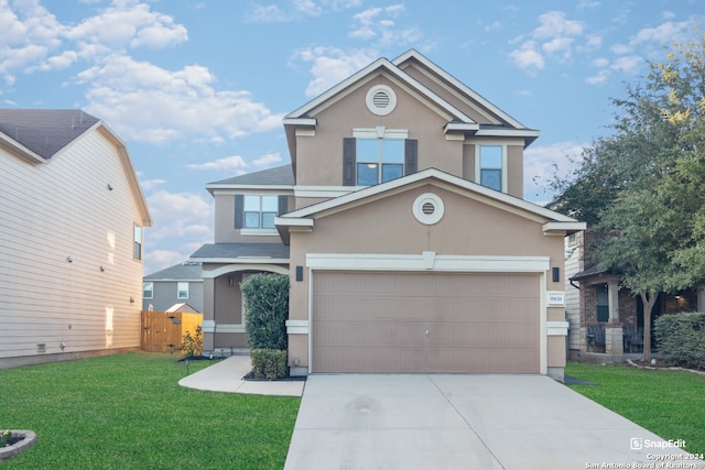 front facade with a front yard and a garage