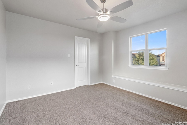 empty room featuring carpet and ceiling fan