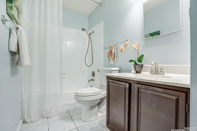 full bathroom featuring tile patterned floors, shower / bath combo with shower curtain, vanity, and toilet