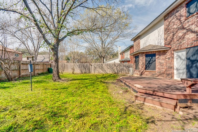 view of yard featuring a wooden deck