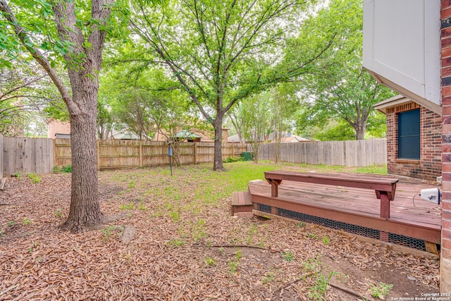 view of yard with a wooden deck