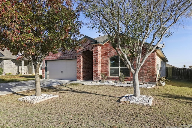 view of front of house featuring a garage and a front lawn