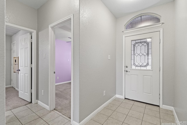 foyer with light tile patterned floors