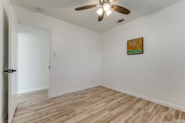 spare room featuring ceiling fan and light hardwood / wood-style floors