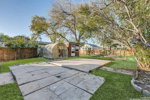 view of patio / terrace with an outbuilding