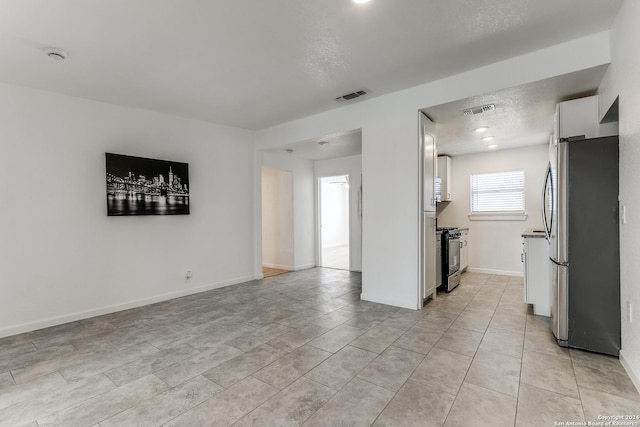 interior space featuring a textured ceiling