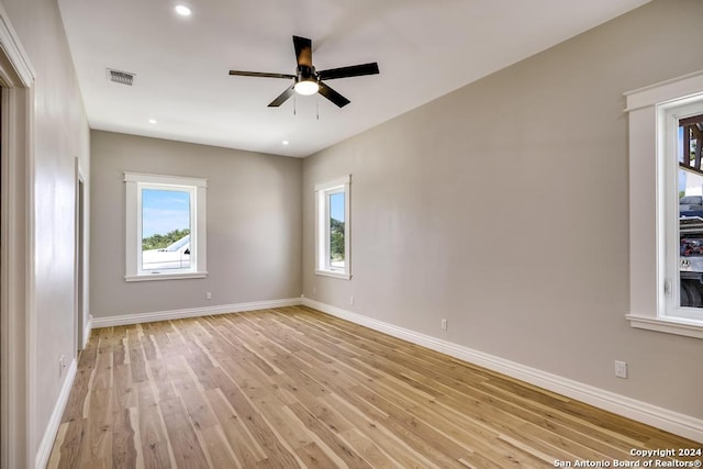 unfurnished room featuring light hardwood / wood-style flooring and ceiling fan