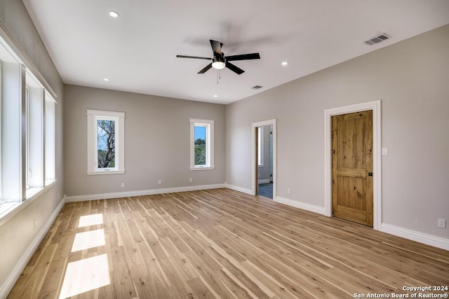 unfurnished room with ceiling fan and light hardwood / wood-style flooring