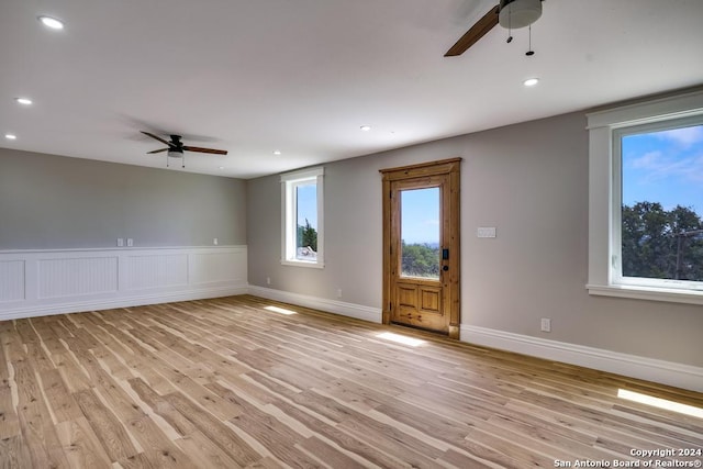 interior space with ceiling fan and light hardwood / wood-style floors