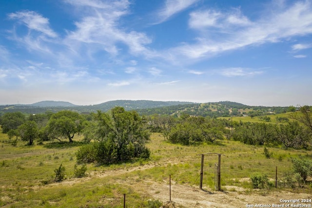 property view of mountains featuring a rural view