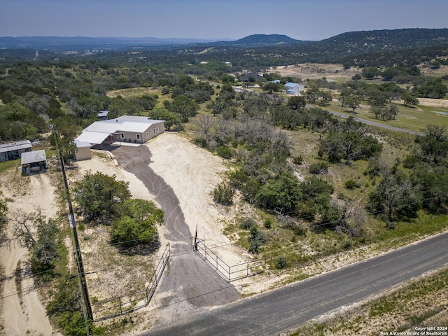 drone / aerial view featuring a mountain view