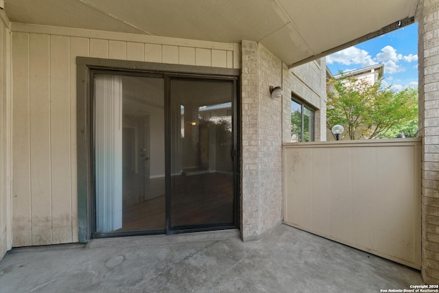 doorway to property featuring a patio