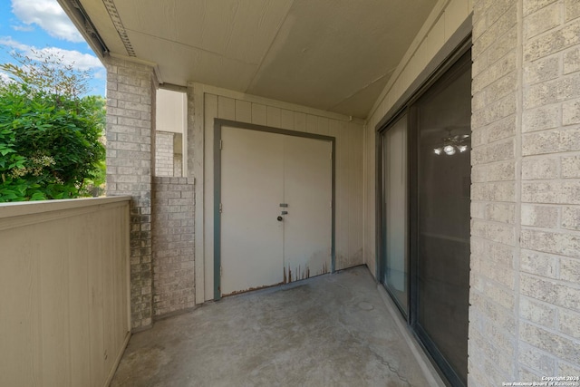 property entrance with a balcony