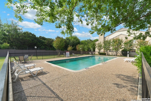 view of pool featuring a patio