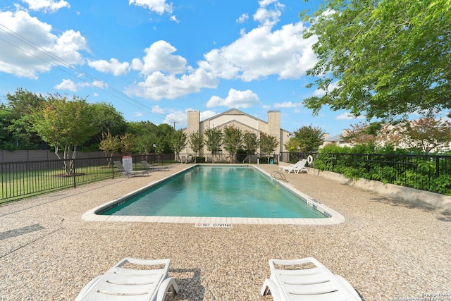 view of pool featuring a patio area