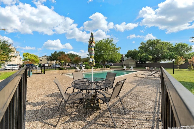 view of patio with a community pool