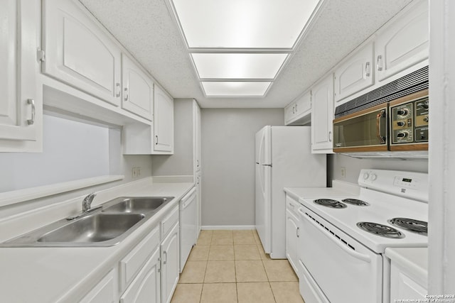 kitchen with white cabinetry, light tile patterned flooring, white appliances, and sink