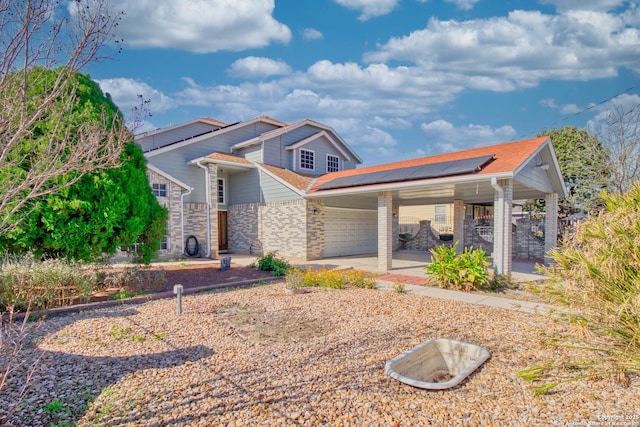 craftsman inspired home with solar panels and a garage