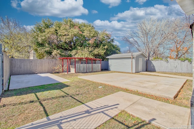 view of yard with an outbuilding and a patio