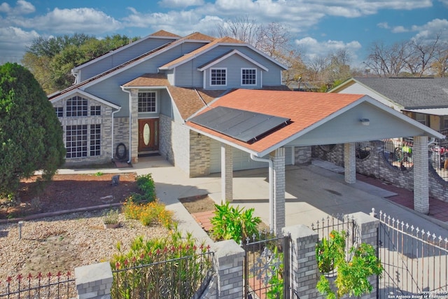 view of front facade with solar panels