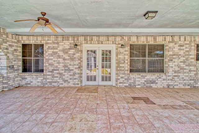 view of patio / terrace featuring ceiling fan and french doors