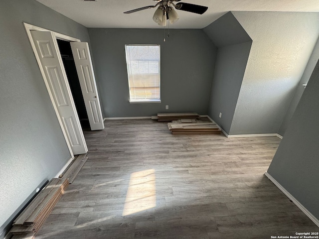 additional living space with ceiling fan and light hardwood / wood-style floors