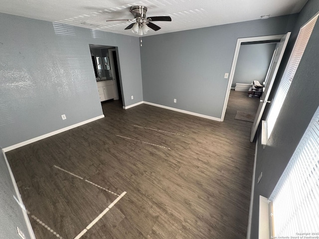 empty room featuring dark hardwood / wood-style floors and ceiling fan