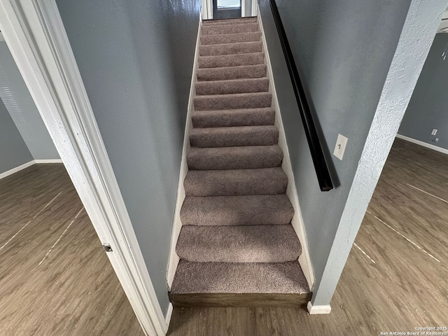 stairway featuring hardwood / wood-style floors