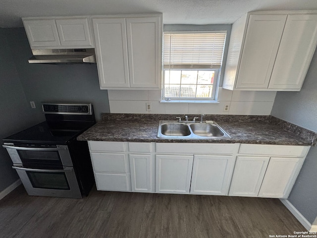 kitchen featuring ventilation hood, dark wood-type flooring, sink, white cabinetry, and stainless steel electric range