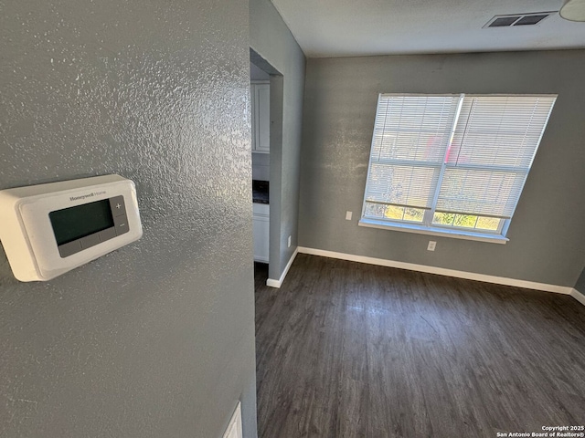 interior space with dark hardwood / wood-style flooring