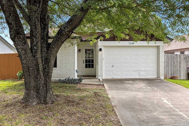 single story home featuring a garage