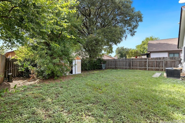 view of yard with a storage unit and cooling unit