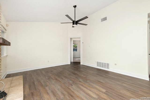 unfurnished living room with ceiling fan, high vaulted ceiling, dark wood-type flooring, and a brick fireplace